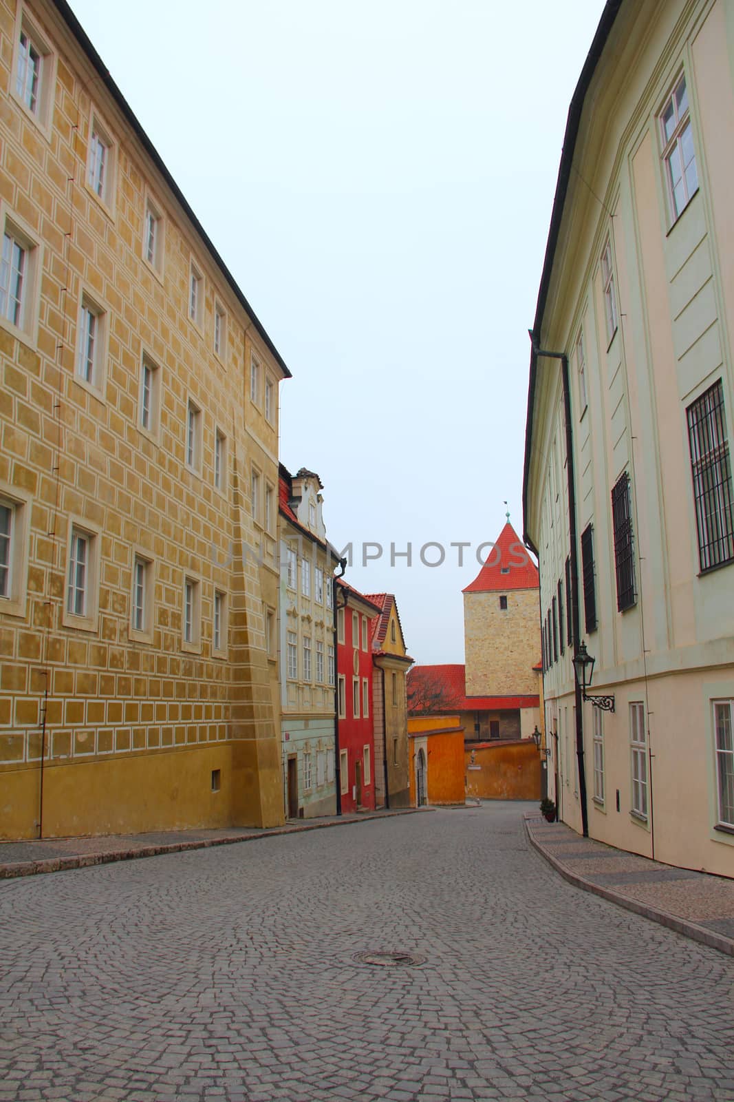 Narrow pedestrian alley between tenement houses in Prague. Stare Mesto. Old town.