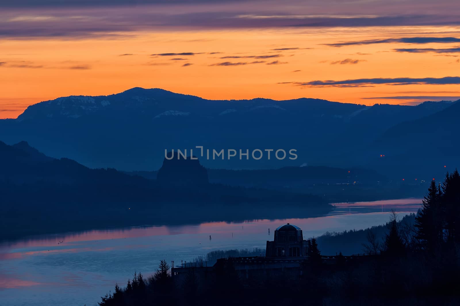 Sunrise over Vista House on Crown Point in Oregon and Beacon Rock in Washington State along Columbia River Gorge