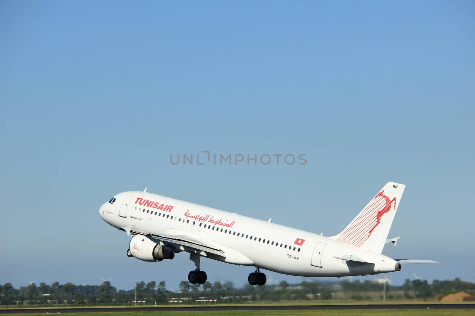 Amsterdam, the Netherlands  - August, 18th 2016: TS-IMM Tunisair Airbus A320-211 
taking off from Polderbaan Runway Amsterdam Airport Schiphol