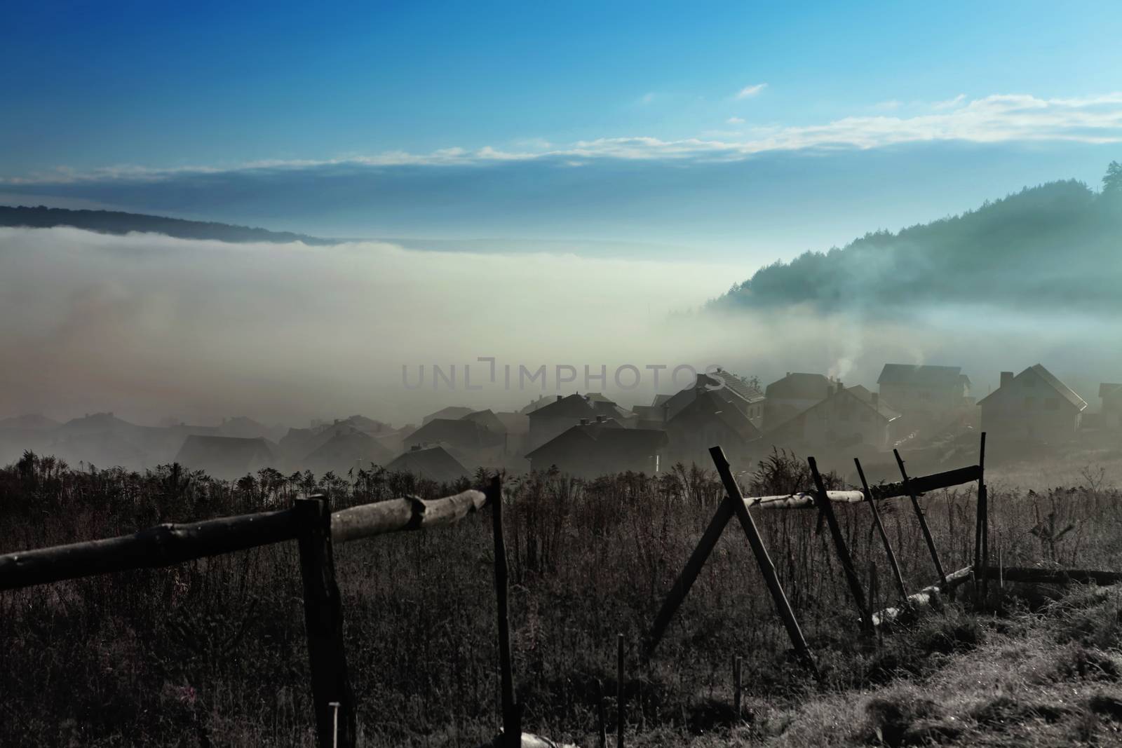 sky with fog over countryside at autumn