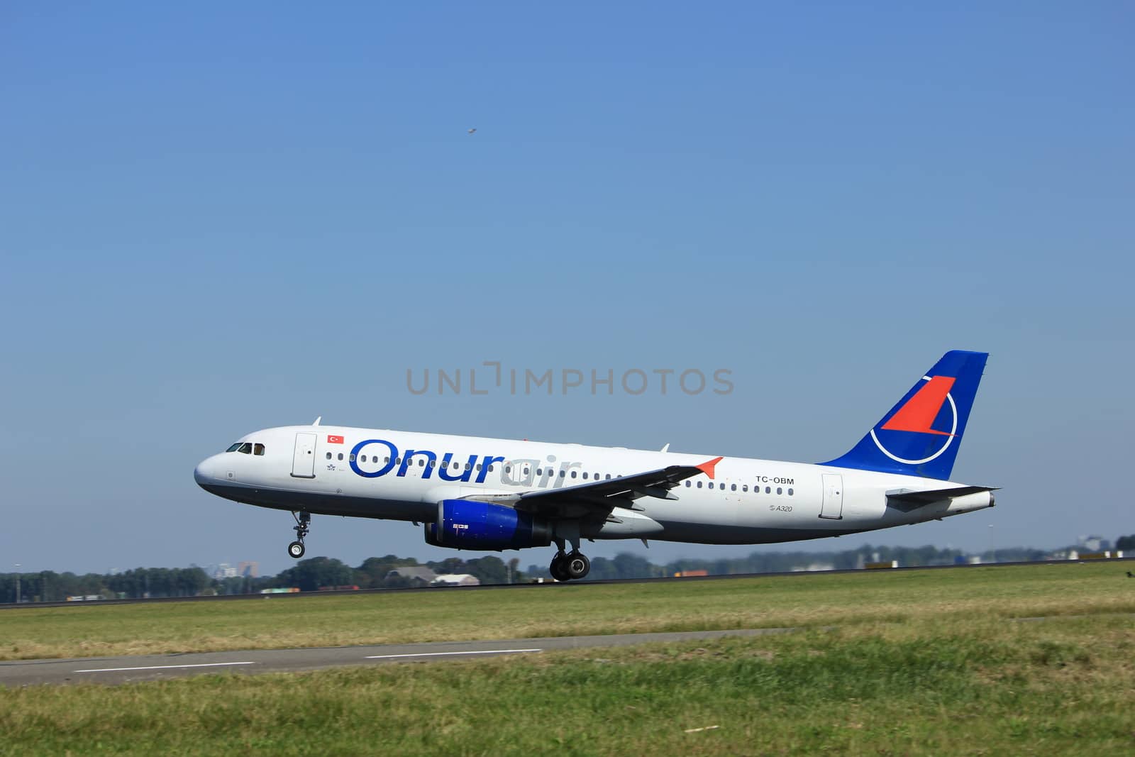 Amsterdam, the Netherlands  - August, 18th 2016: TC-OBM Onur Air Airbus A320-232,
taking off from Polderbaan Runway Amsterdam Airport Schiphol