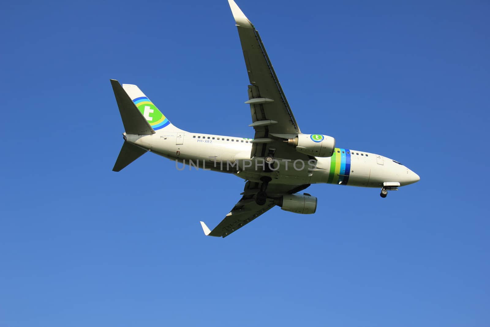 Amsterdam the Netherlands - May, 6th 2016: PH-XRZ Transavia Boeing 737 approaching Schiphol Zwanenburg runway 18C, arriving from Naples, Italy