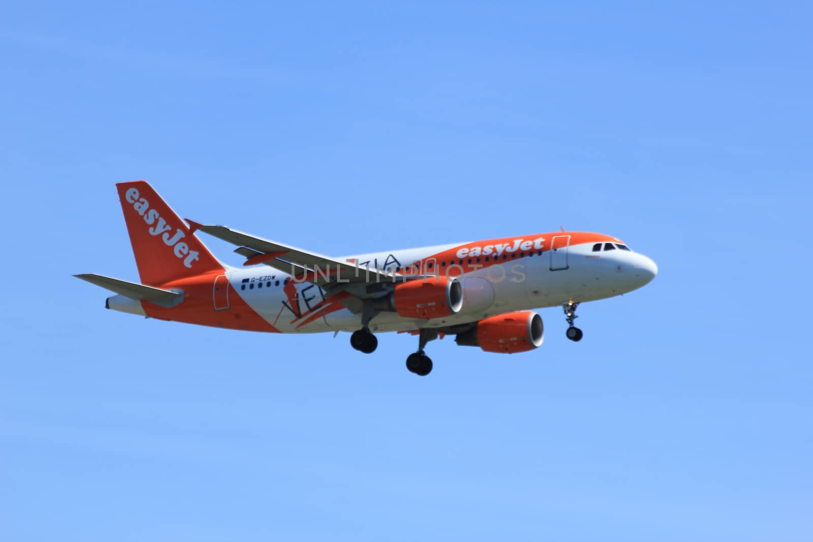 Amsterdam the Netherlands - May, 5th 2016:  G-EZDW easyJet Airbus A319-111
 approaching Schiphol Polderbaan runway, arriving from Edinburgh, United Kingdom