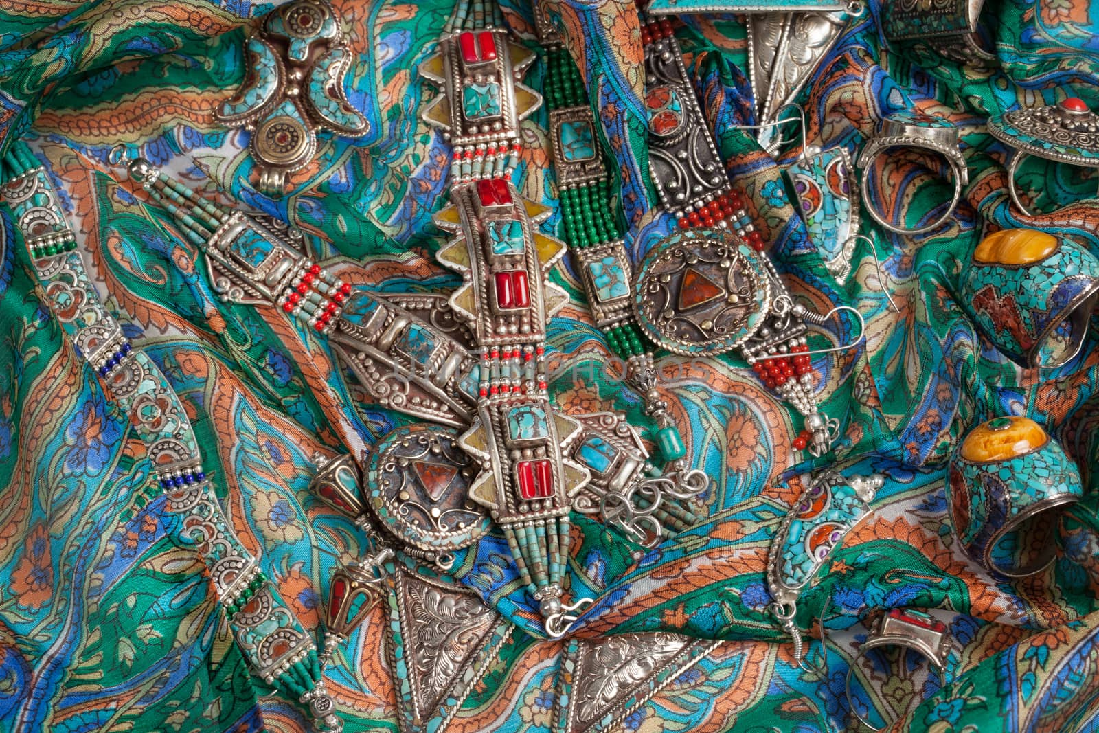 Handmade jewelry on fabric bacground in ethnic style