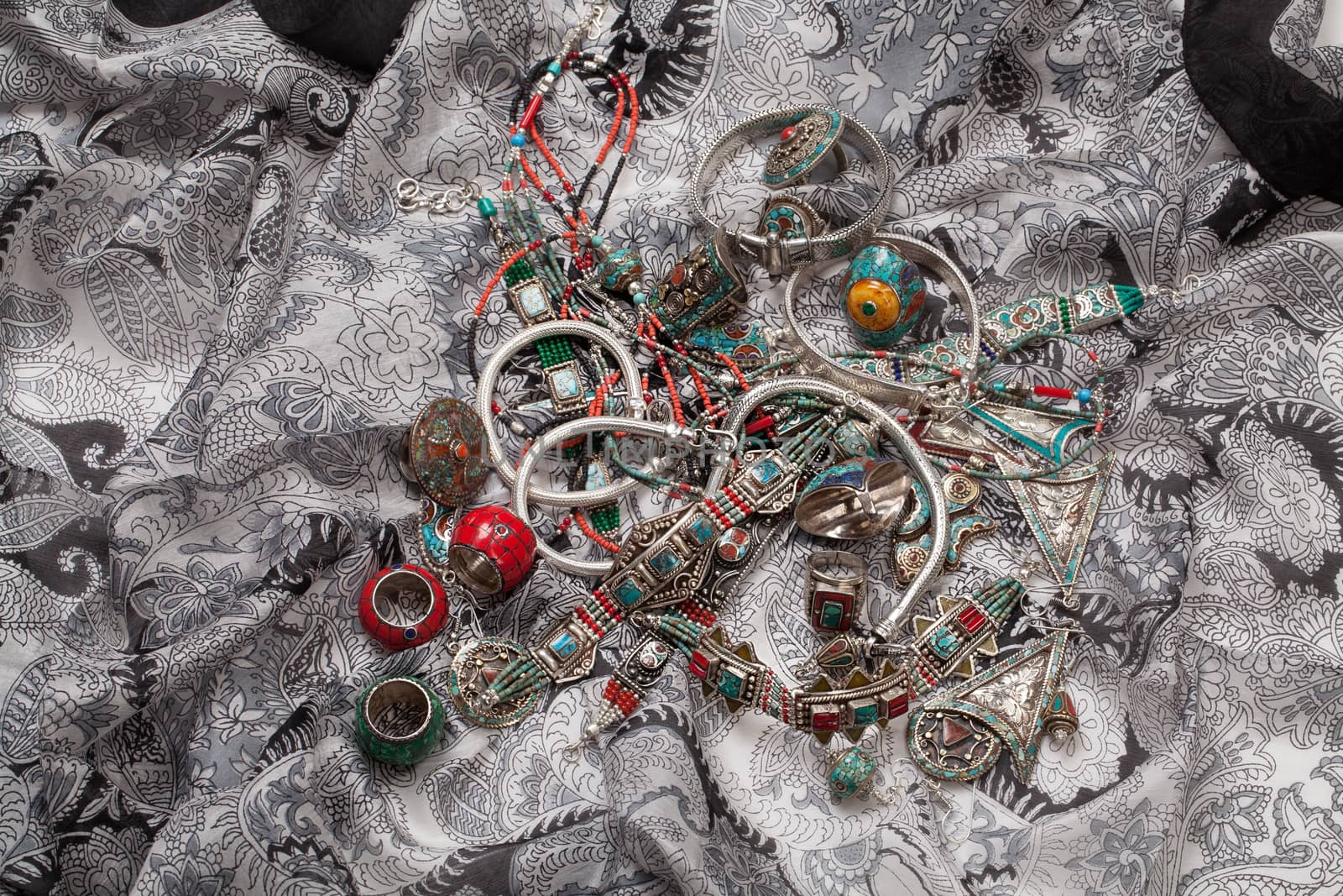 Handmade jewelry on fabric bacground in ethnic style