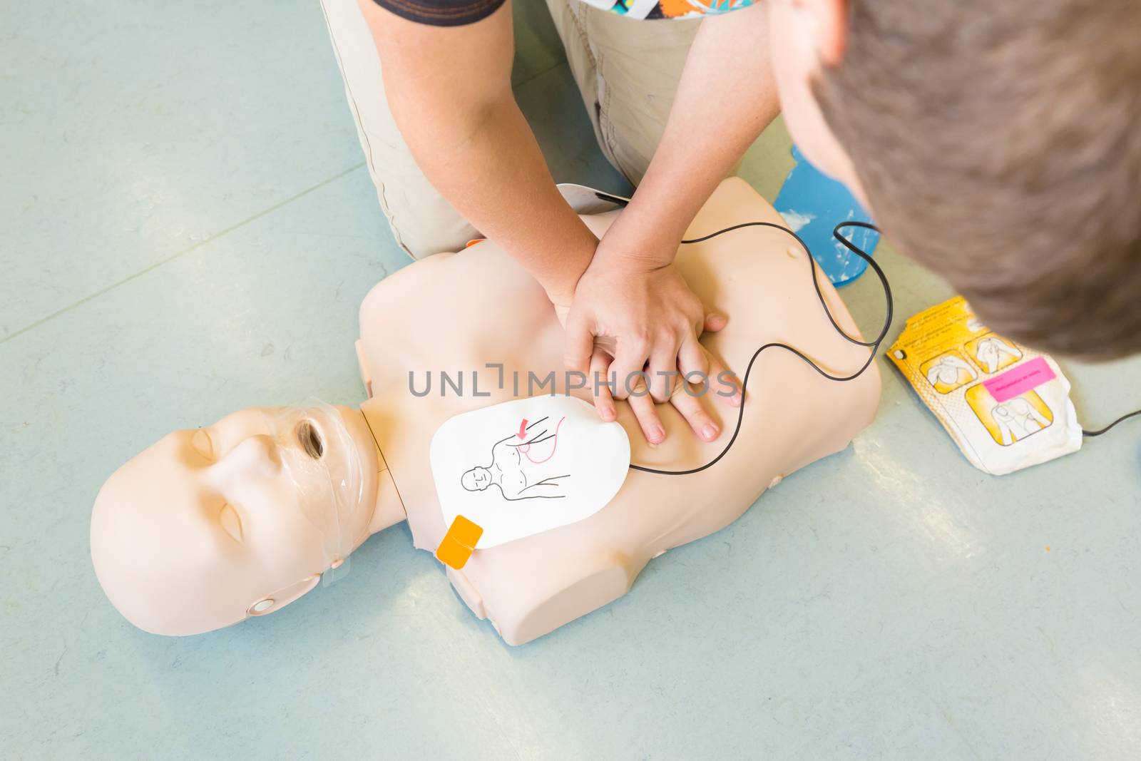 First aid cardiopulmonary resuscitation course using automated external defibrillator device, AED.