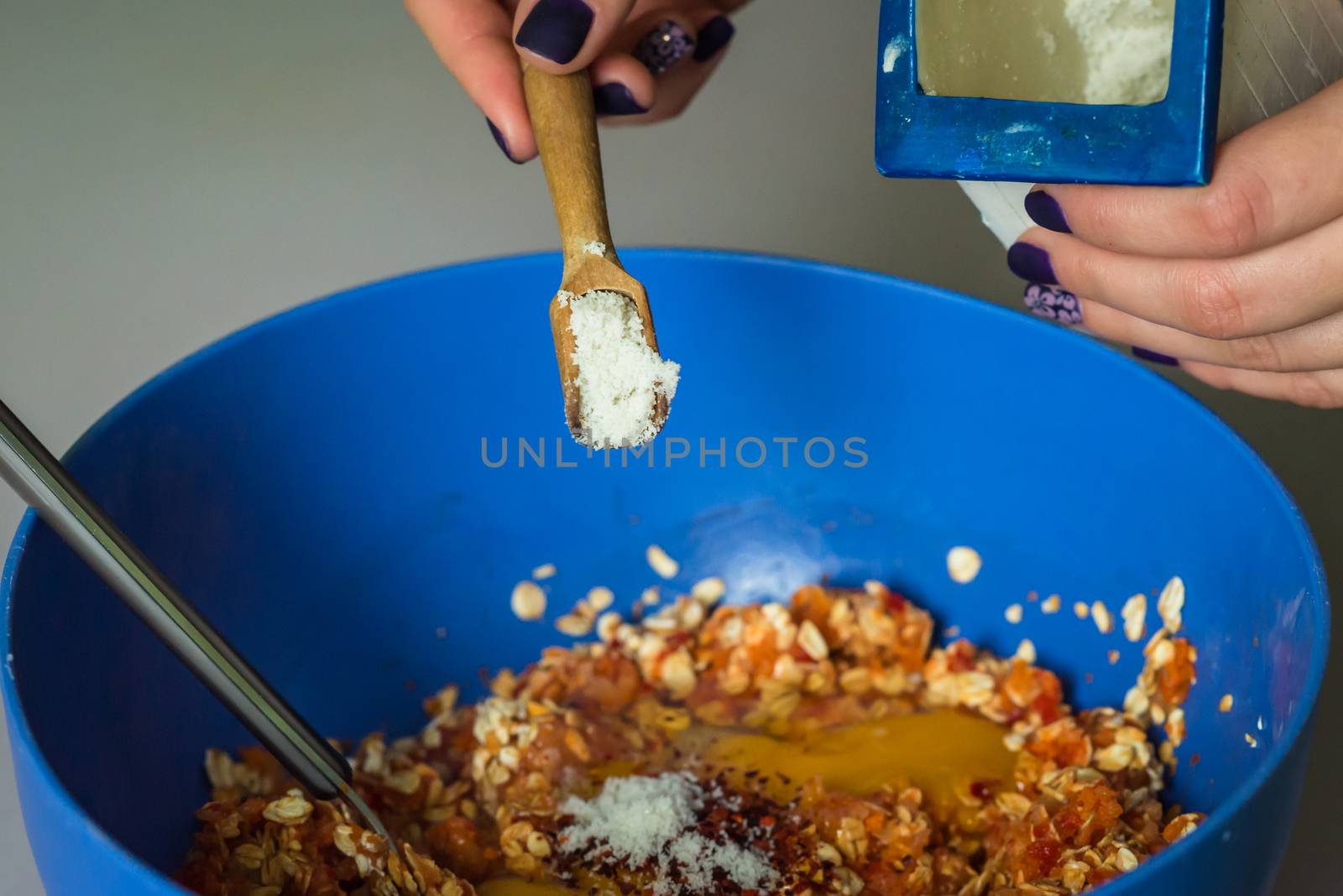 hand pour in salt from wooden spoons in stuffing