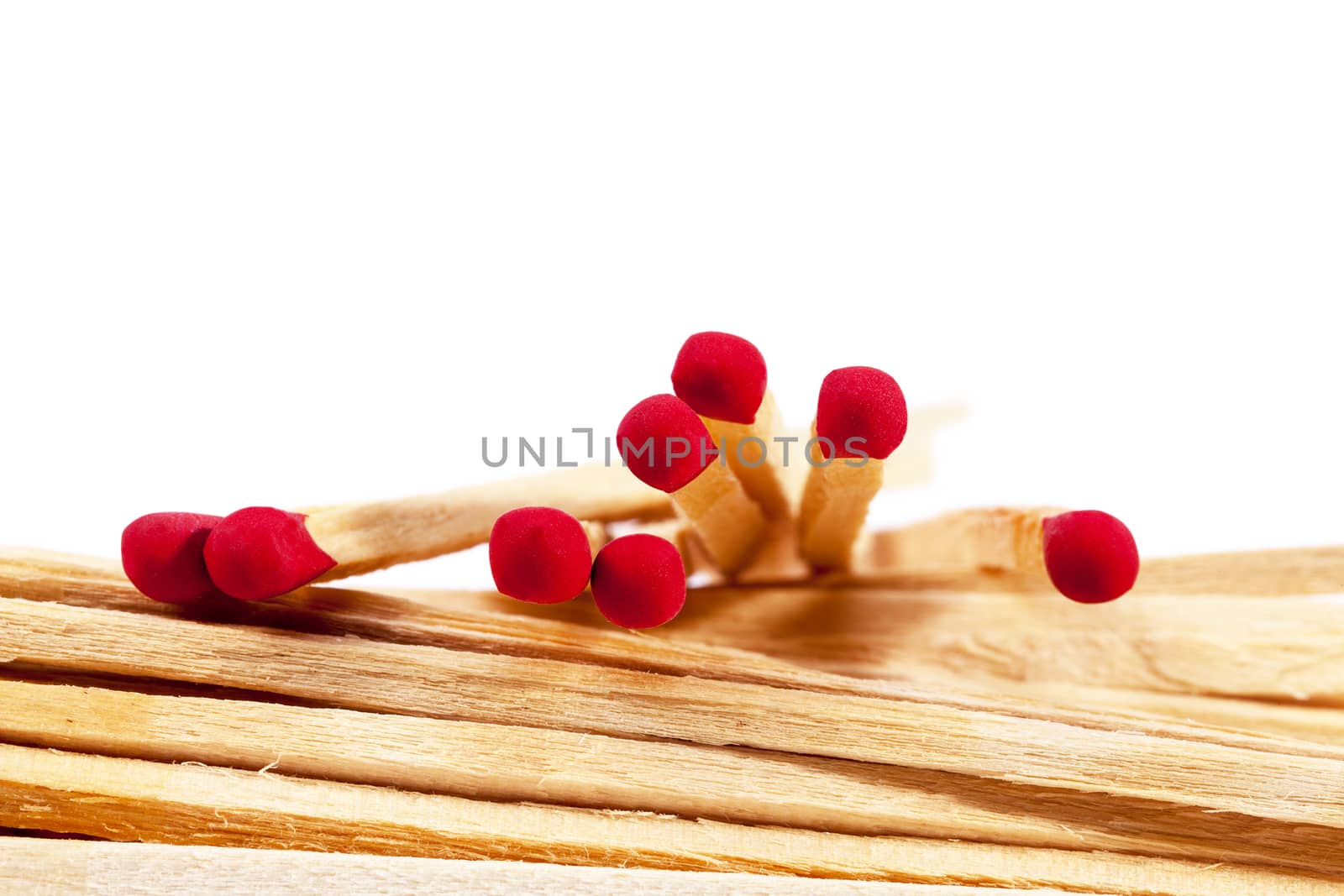 Heap of matches with rad heads isolated on white background by mychadre77