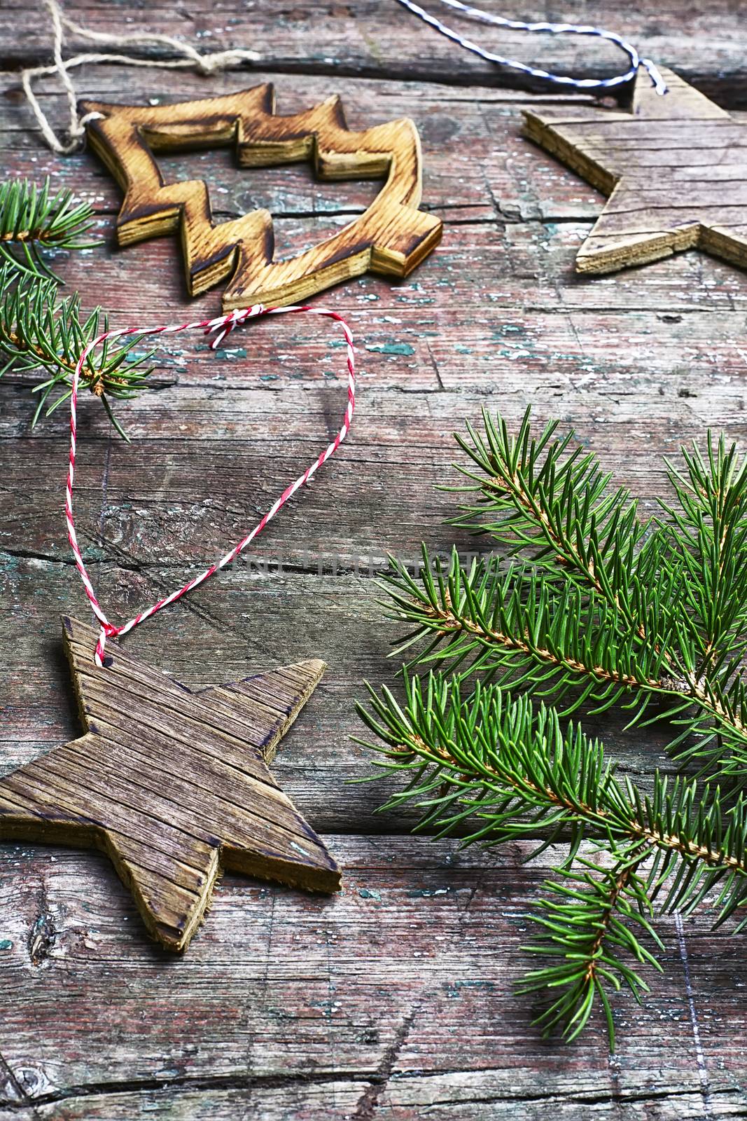 Christmas toy, vintage wooden Christmas tree on background with Christmas fir