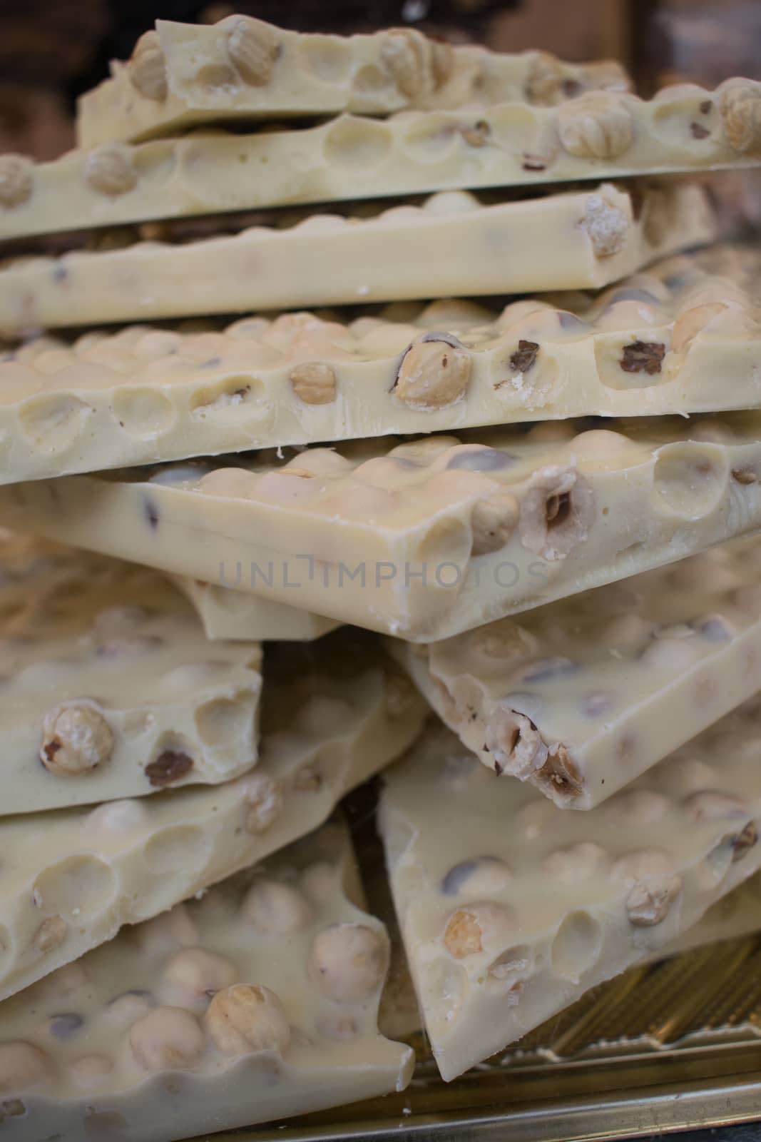 Background of pieces of white chocolate in a pile