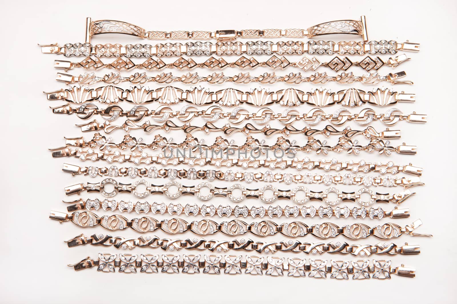 Golden bracelets on a studio background