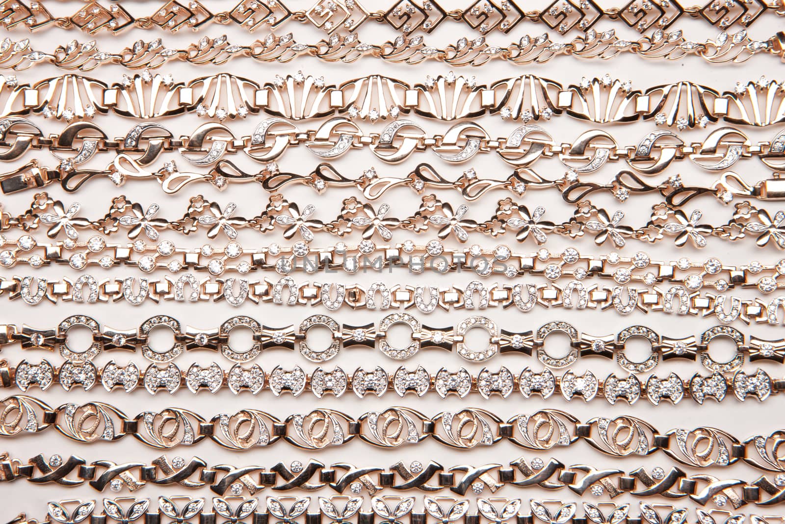Golden bracelets on a studio background