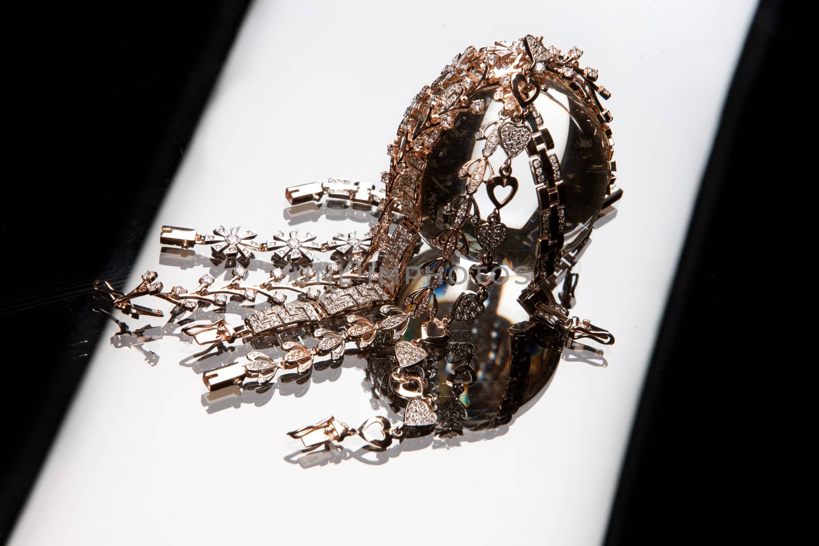 Golden bracelets on a studio background