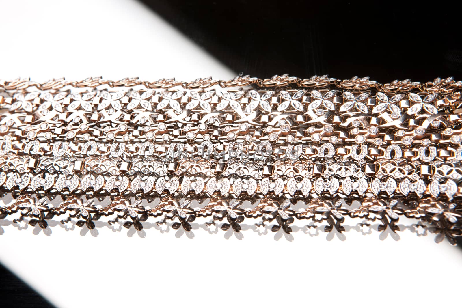 Golden bracelets on a studio background