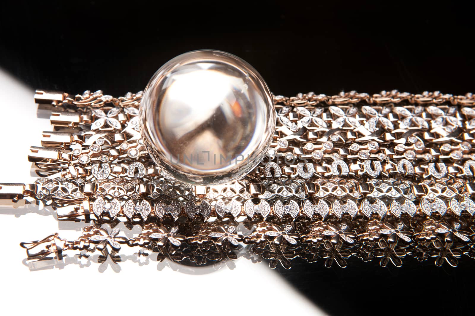 Golden bracelets on a studio background