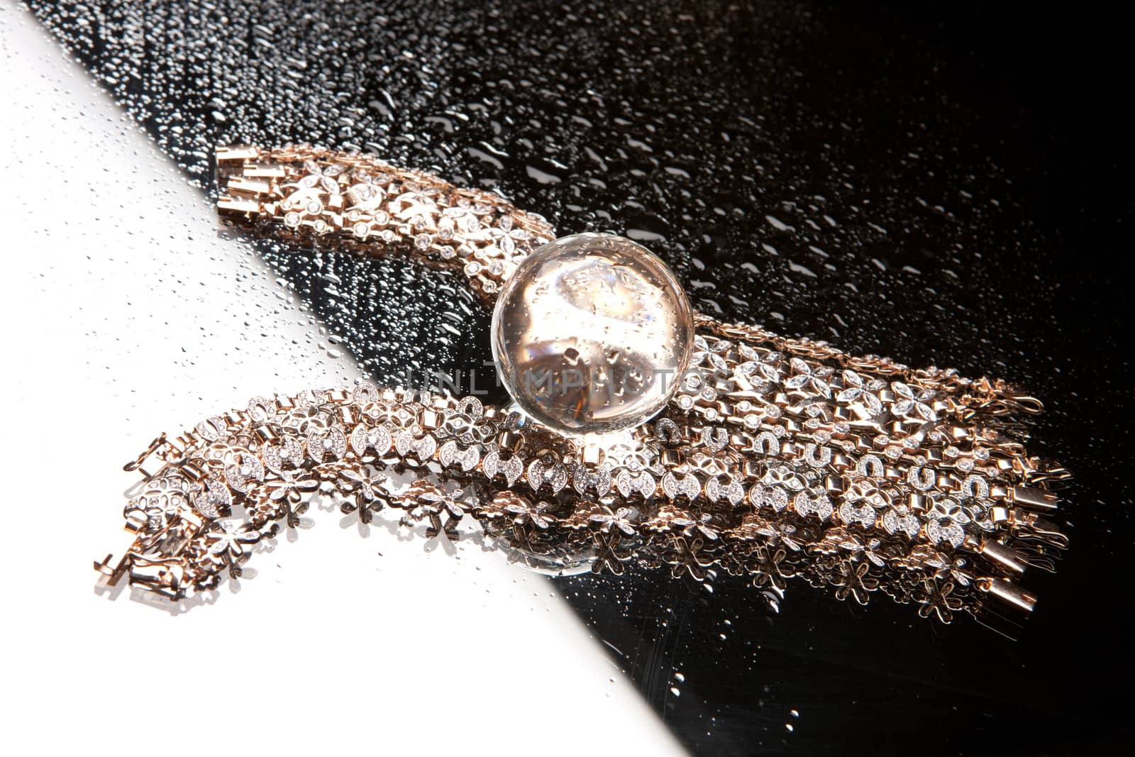 Golden bracelets on a studio background