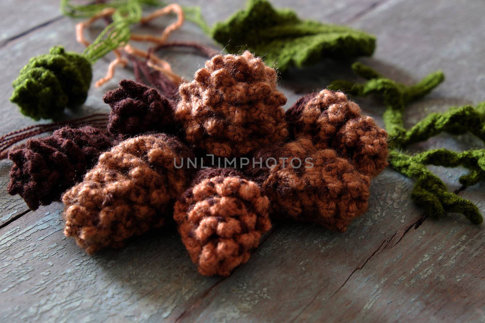 Group of knitted pinecone from brown yarn to decor for Xmas holiday, pine cone is popular Christmas ornament in wintertime