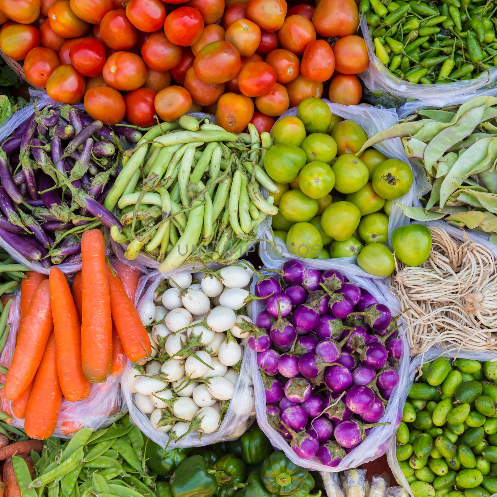 Farmers market with various domestic colorful fresh fruits and vegetable. Tasty colorful mix.