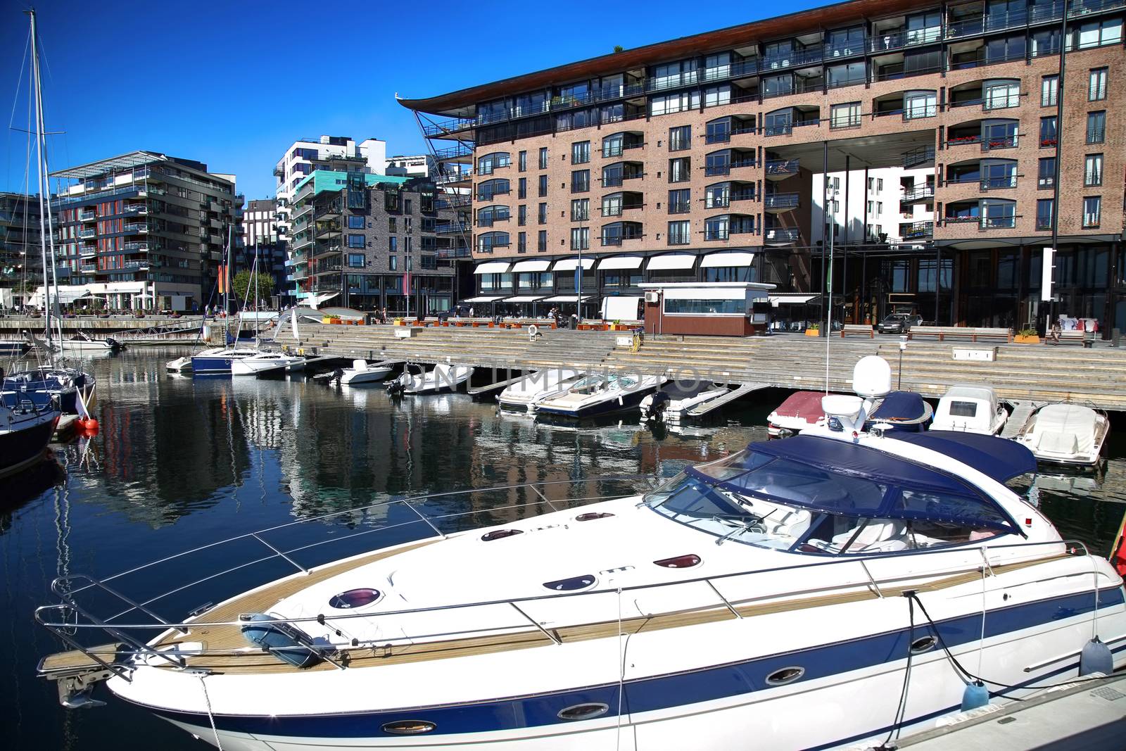Yacht and modern district on street Stranden, Aker Brygge in Oslo, Norway