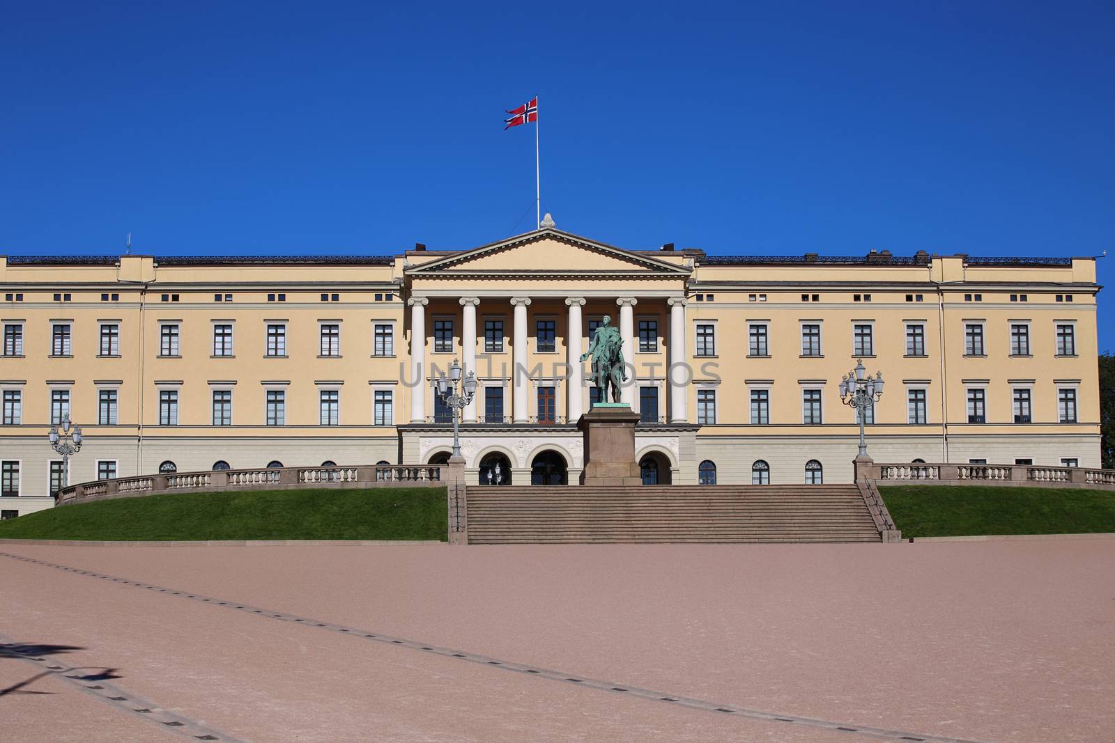 The Royal Palace and statue of King Karl Johan XIV in Oslo, Norw by vladacanon