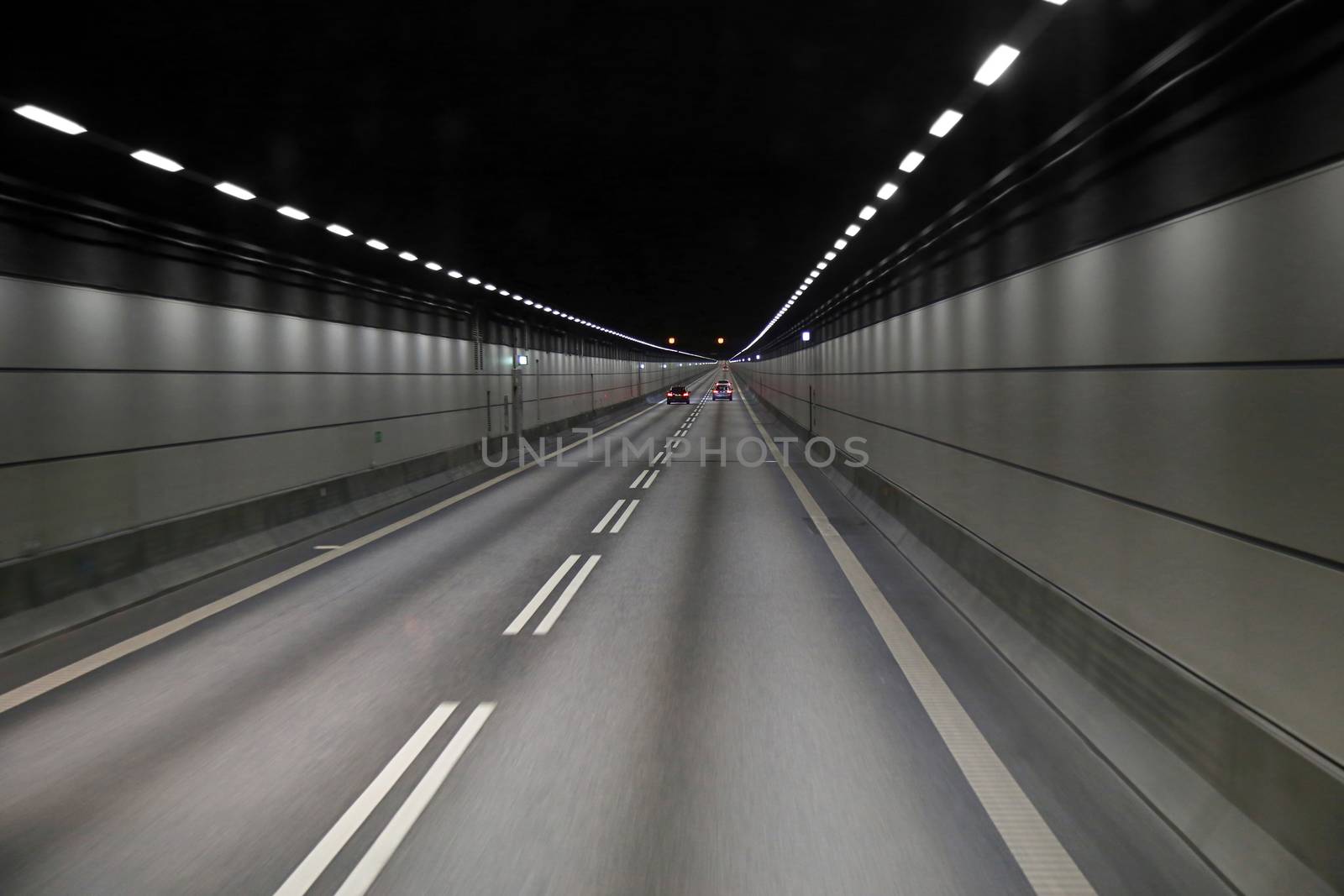 Cars in a tunnel on Oresund bridge between Sweden and Denmark by vladacanon