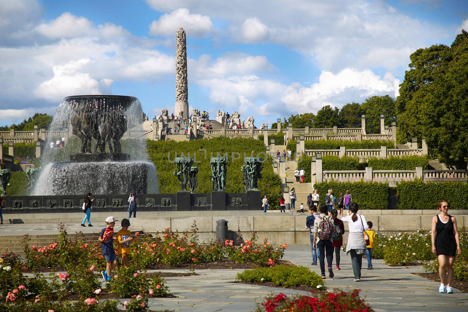 EDITORIAL OSLO, NORWAY - AUGUST 18, 2016: Many tourist walk Vigeland Sculptures Park in the popular Vigeland park ( Frogner Park ), designed by Gustav Vigeland in Oslo, Norway on August 18, 2016. 