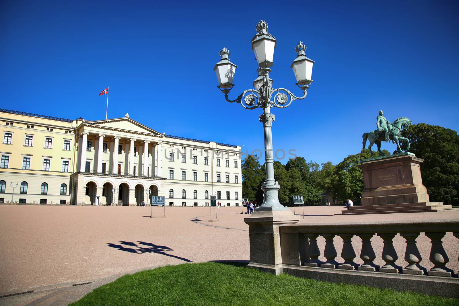 OSLO, NORWAY – AUGUST 17, 2016: Tourist visit The Royal Palace and statue of King Karl Johan XIV, Oslo is the capital city of Norway in Oslo, Norway on August 17,2016.