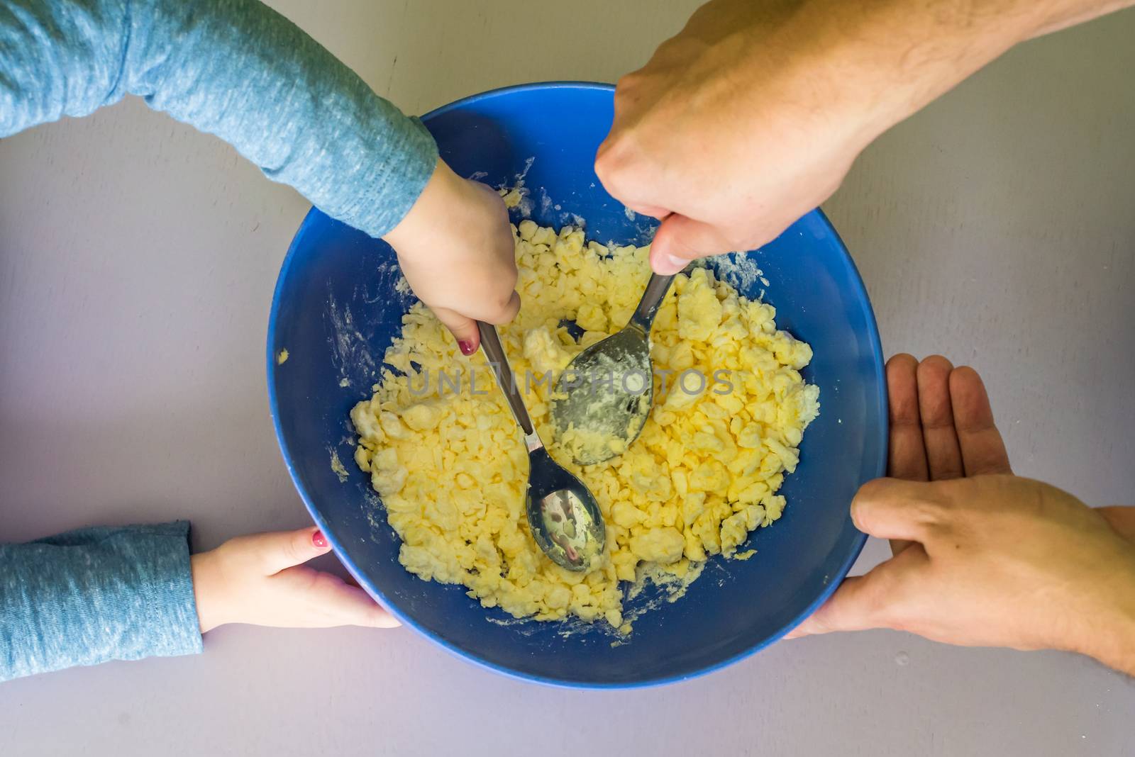 Children and dad hands preparing shortbread dough by okskukuruza