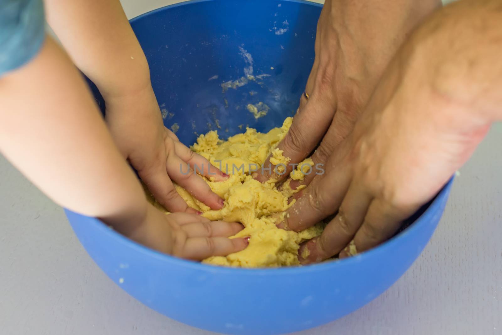 Children and dad hands preparing shortbread dough by okskukuruza