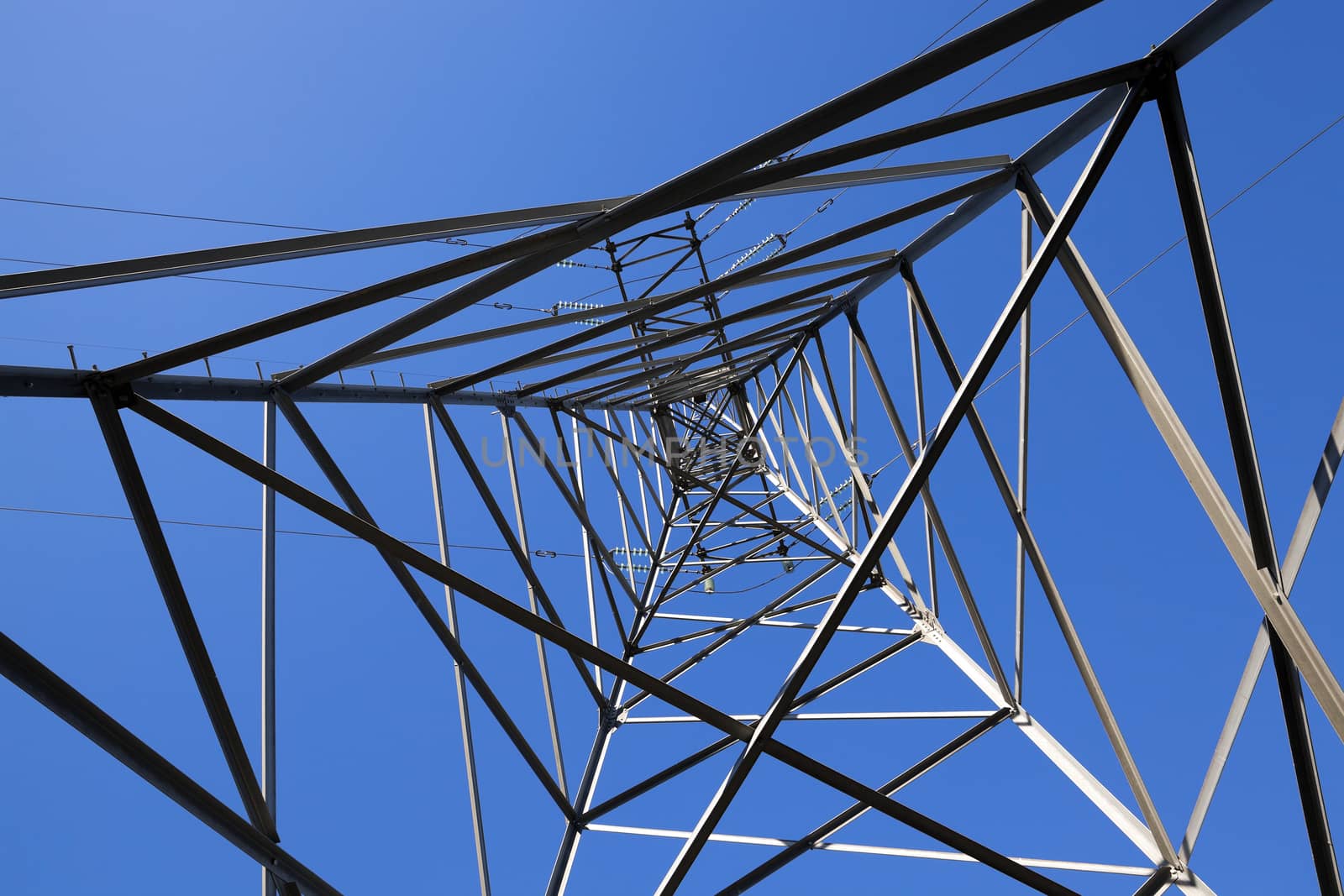 photographed close-up, high-voltage electric poles located in the countryside