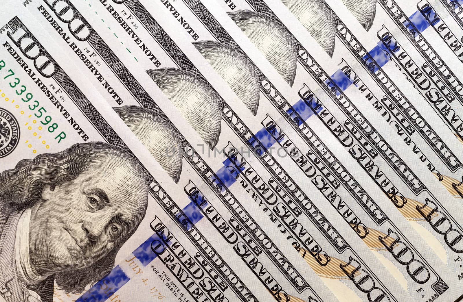 put together the American dollars. Photo close-up of banknotes on 100