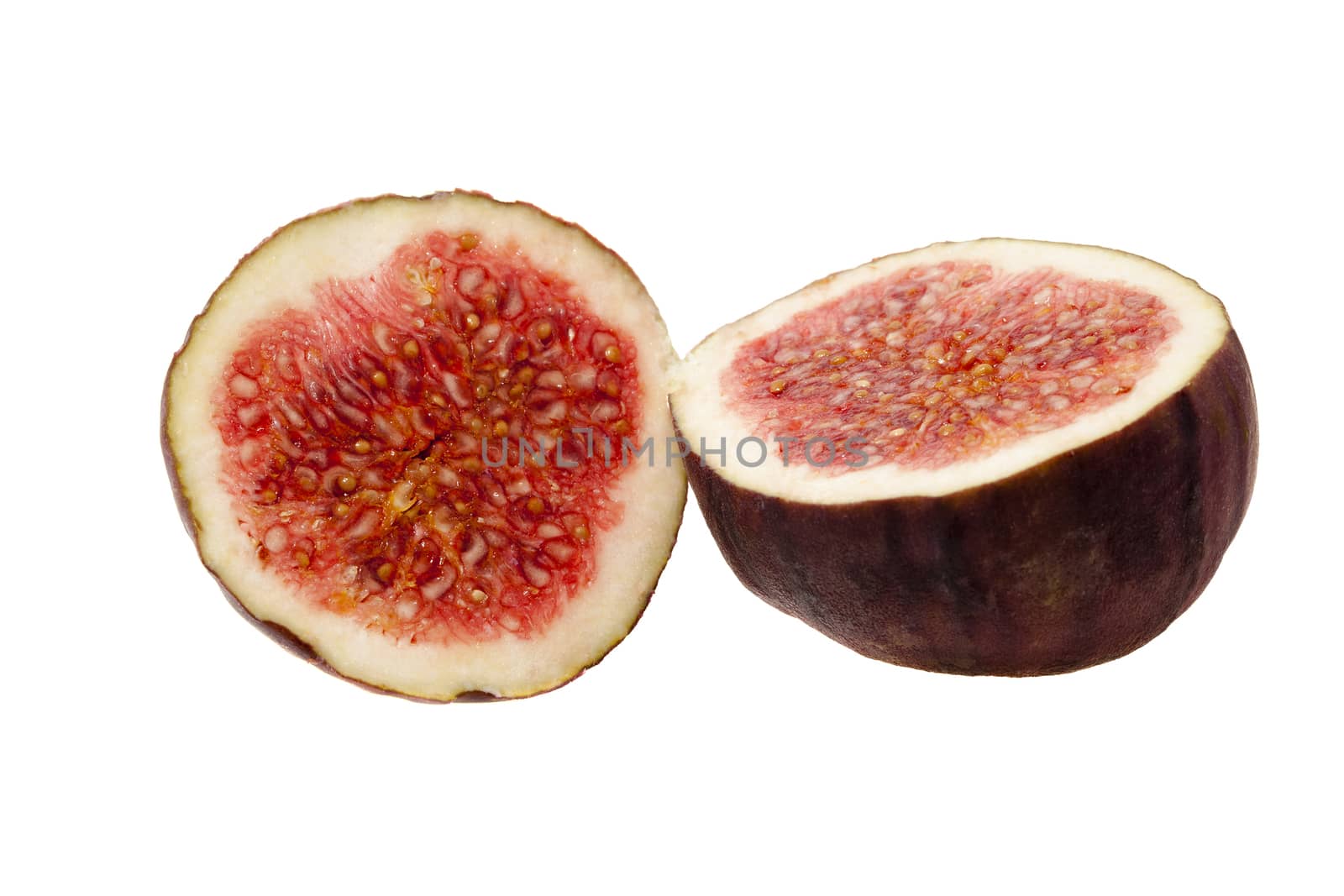 photographed close-up of red ripe fresh figs, cut into two halves