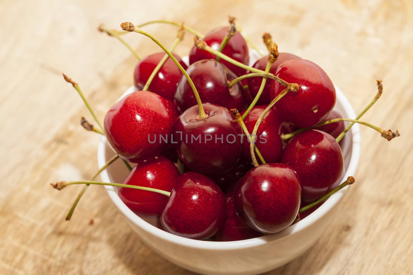 ripe cherry maroon. Berries are together after the harvest. Small depth of field. Photo taken closeup.