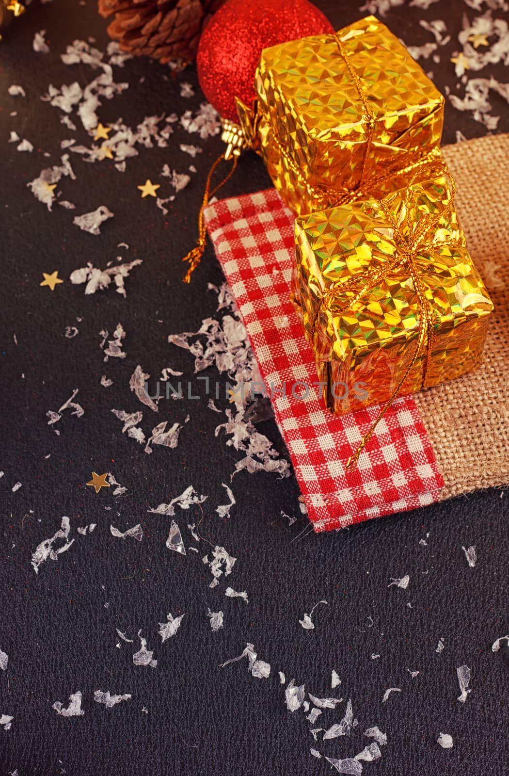 Christmas decorative gift box, ball and drum on black background