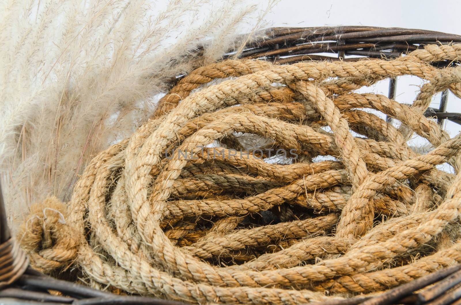 Hemp rope wicker brown basket isolated on white