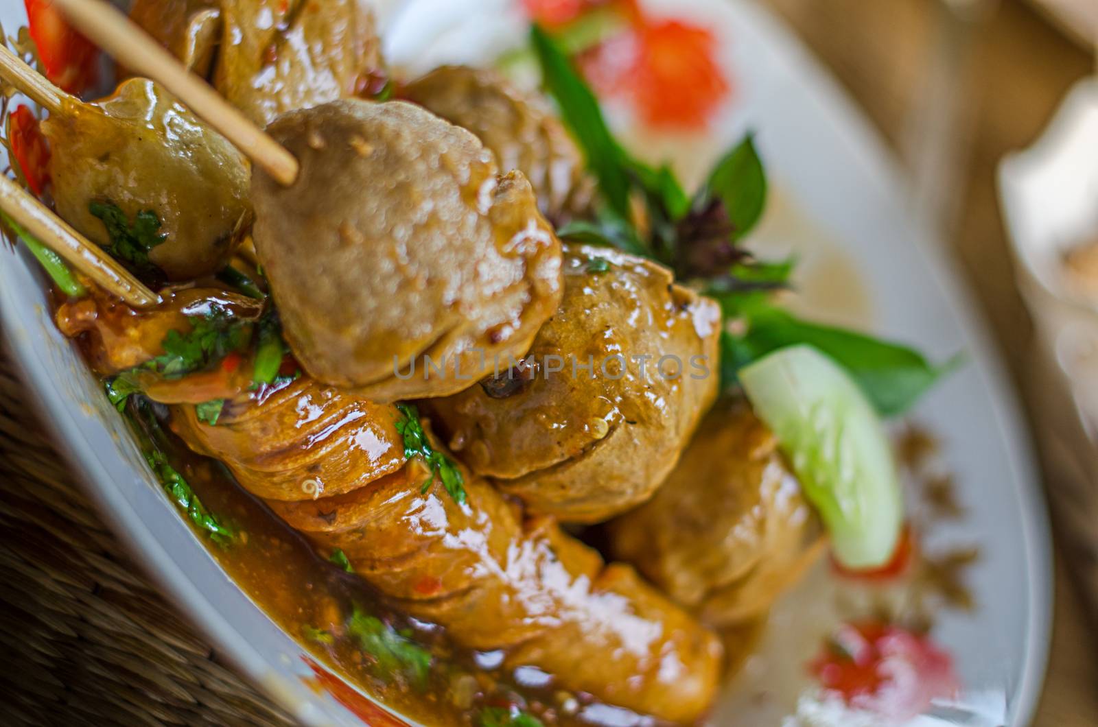 Fried meatballs on skewers close-up