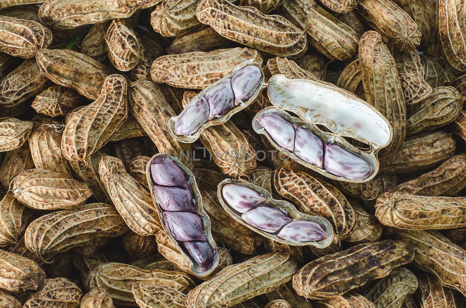 Peanuts in their shell to boil textured food background.