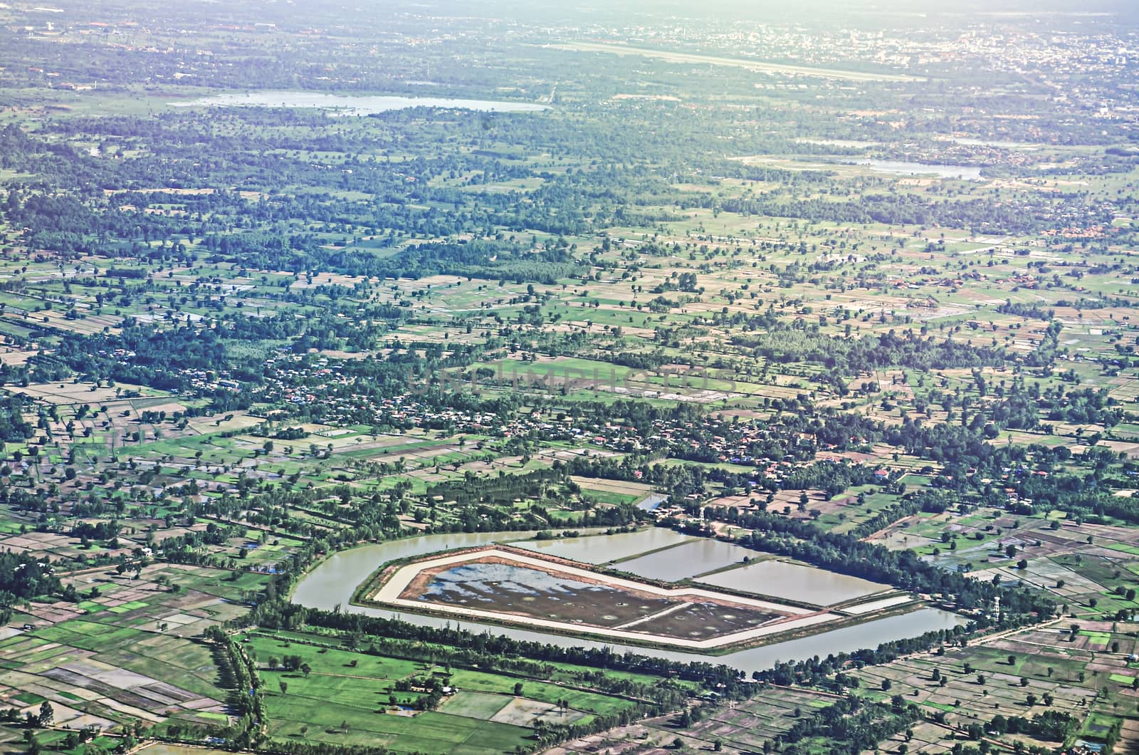 Aerial view of clouds over green land features in thai