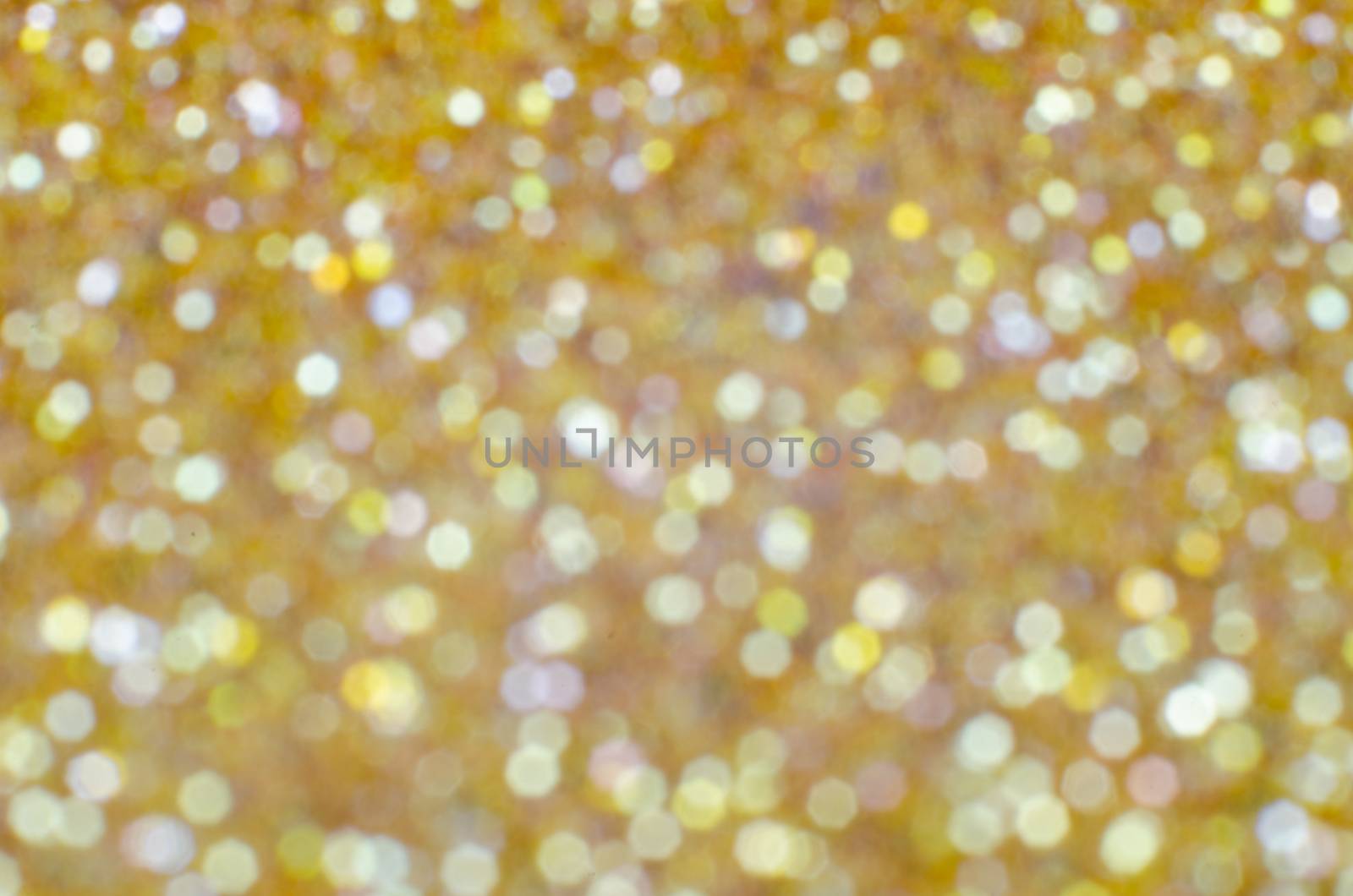 Gold defocused Christmas festival glitter background with copy space