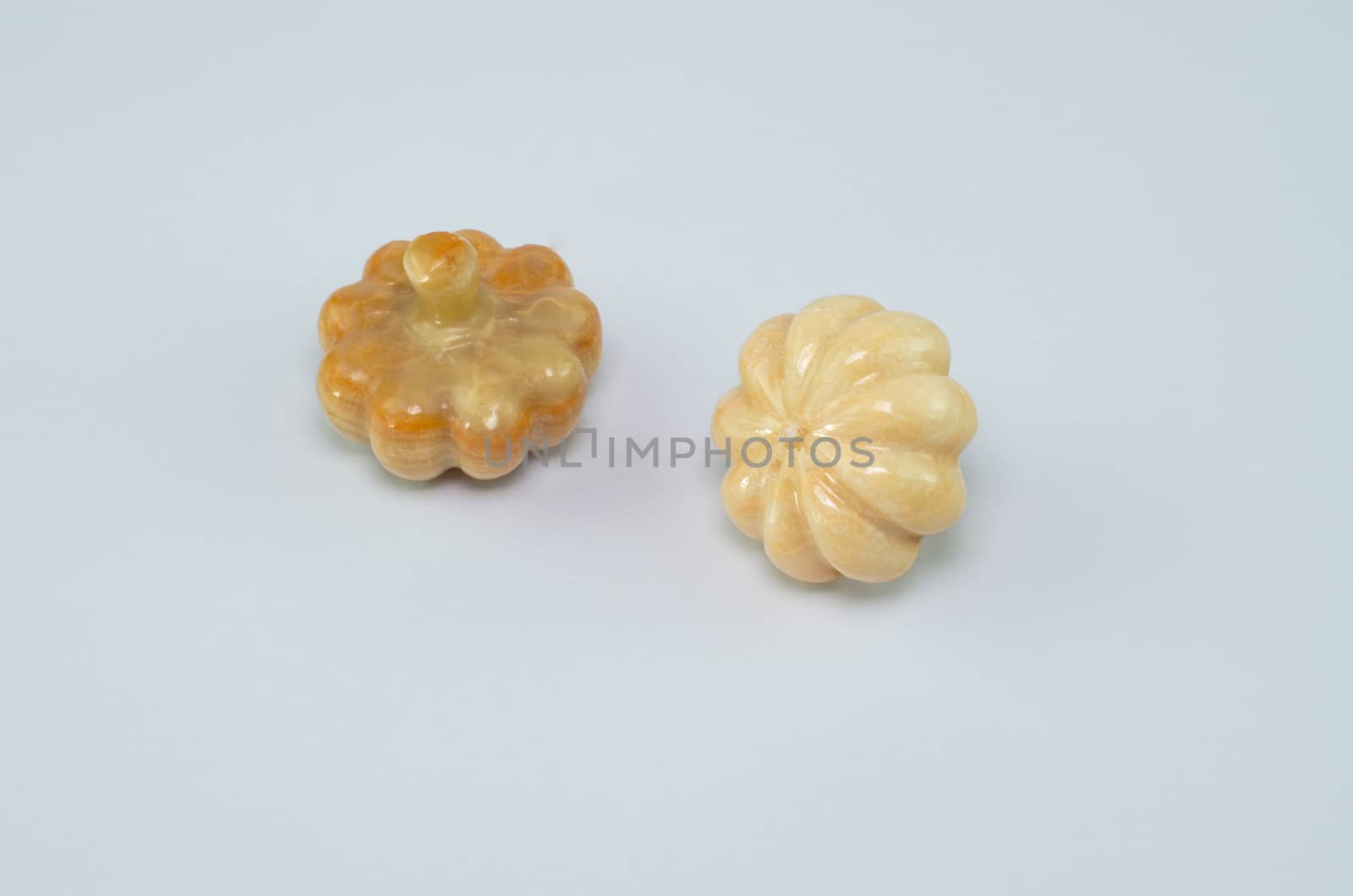 Pumpkin stone on a white background.