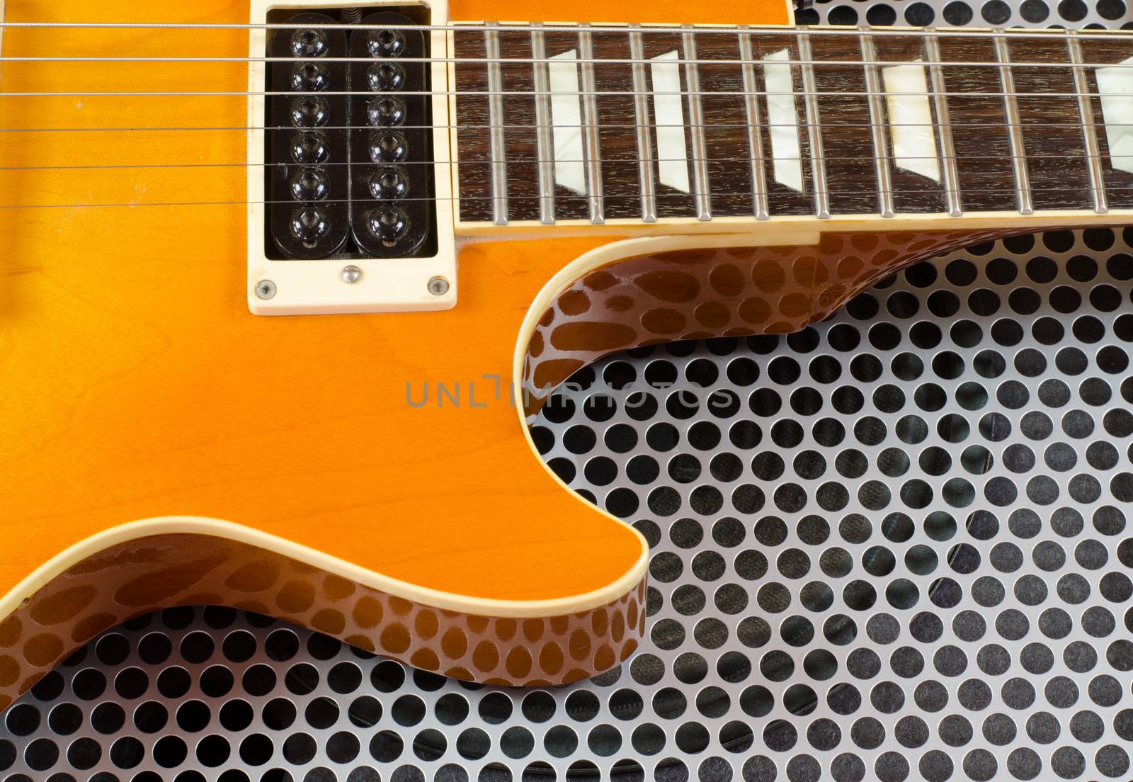 Electric guitar close up  on Metal surface