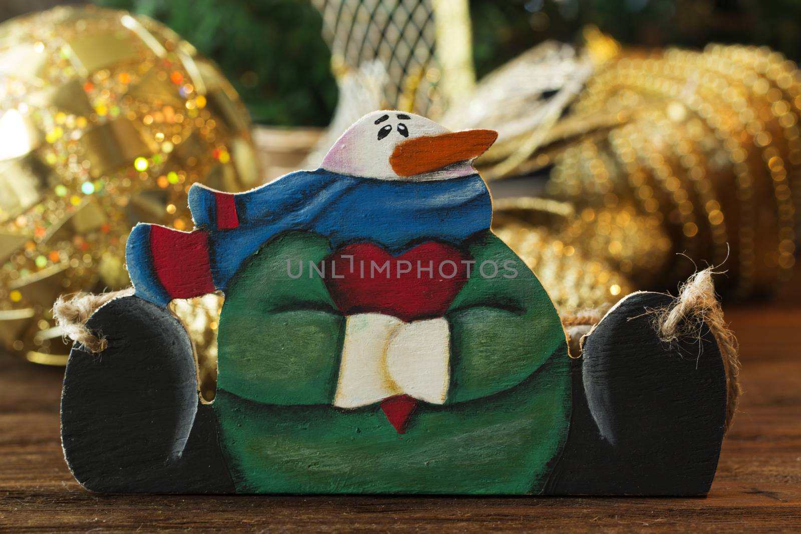 wooden snowman. Christmas toy of snowman. Cute snowmen on Christmas background