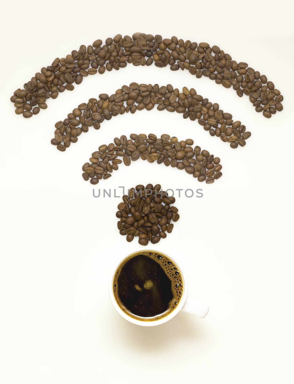 Creative concept photo of  a cup with coffee beans in the shape of wi-fi sign on white background.