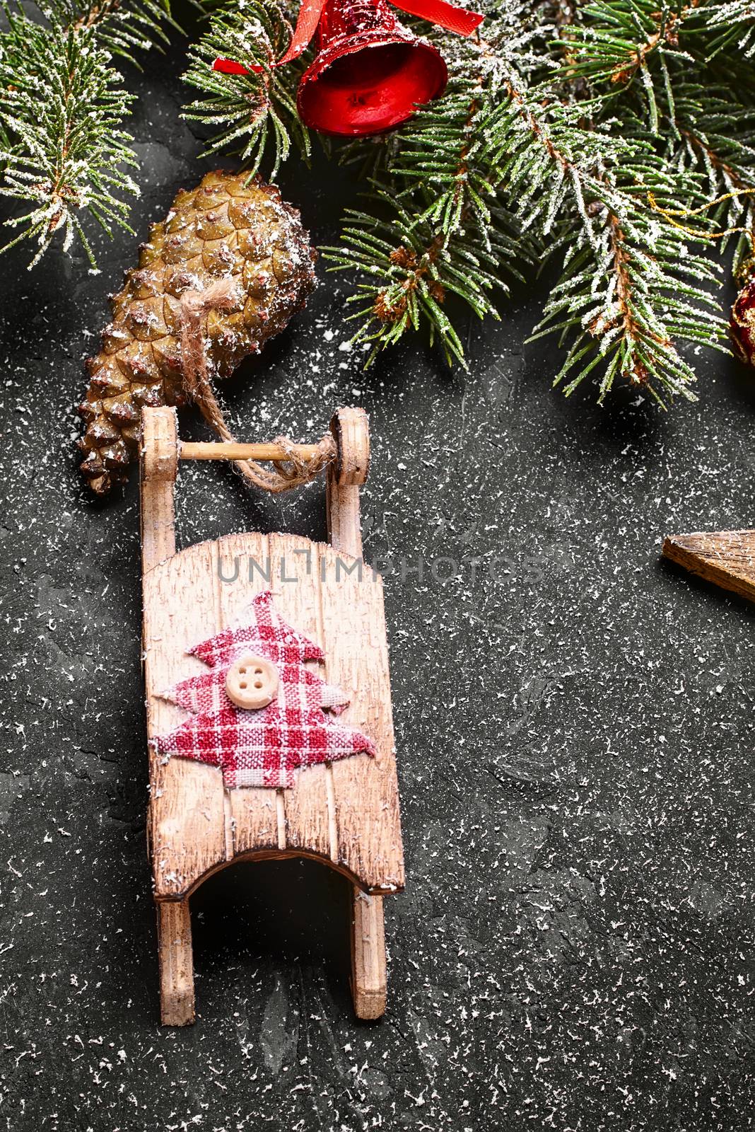 Spruce branches with pinecones and Christmas ornaments