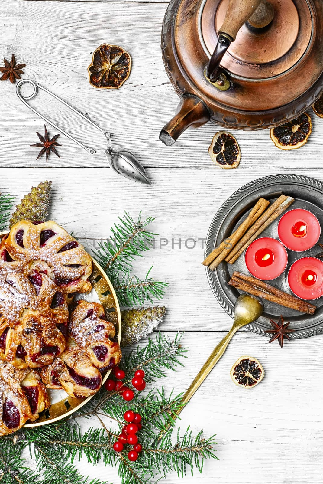 Homemade cookies on plate decorated with fir branches