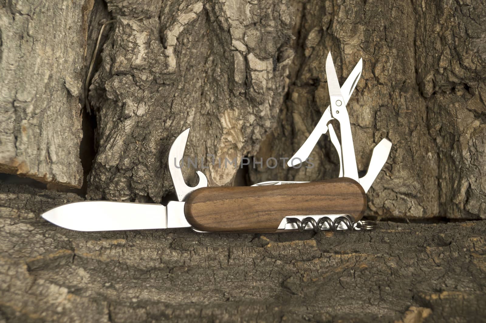 Folding multipurpose knife with the wooden handle