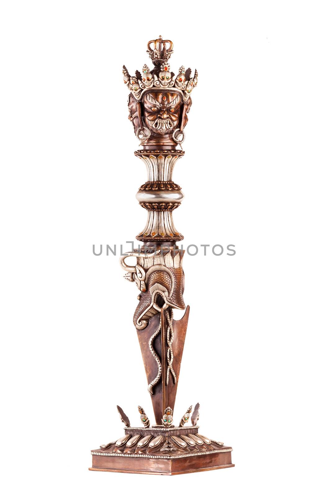 Ritual blade of Phurba which is used in Tantric Buddhism of destruction of all concepts and attachment to an ego. Isolated on a white background.
              