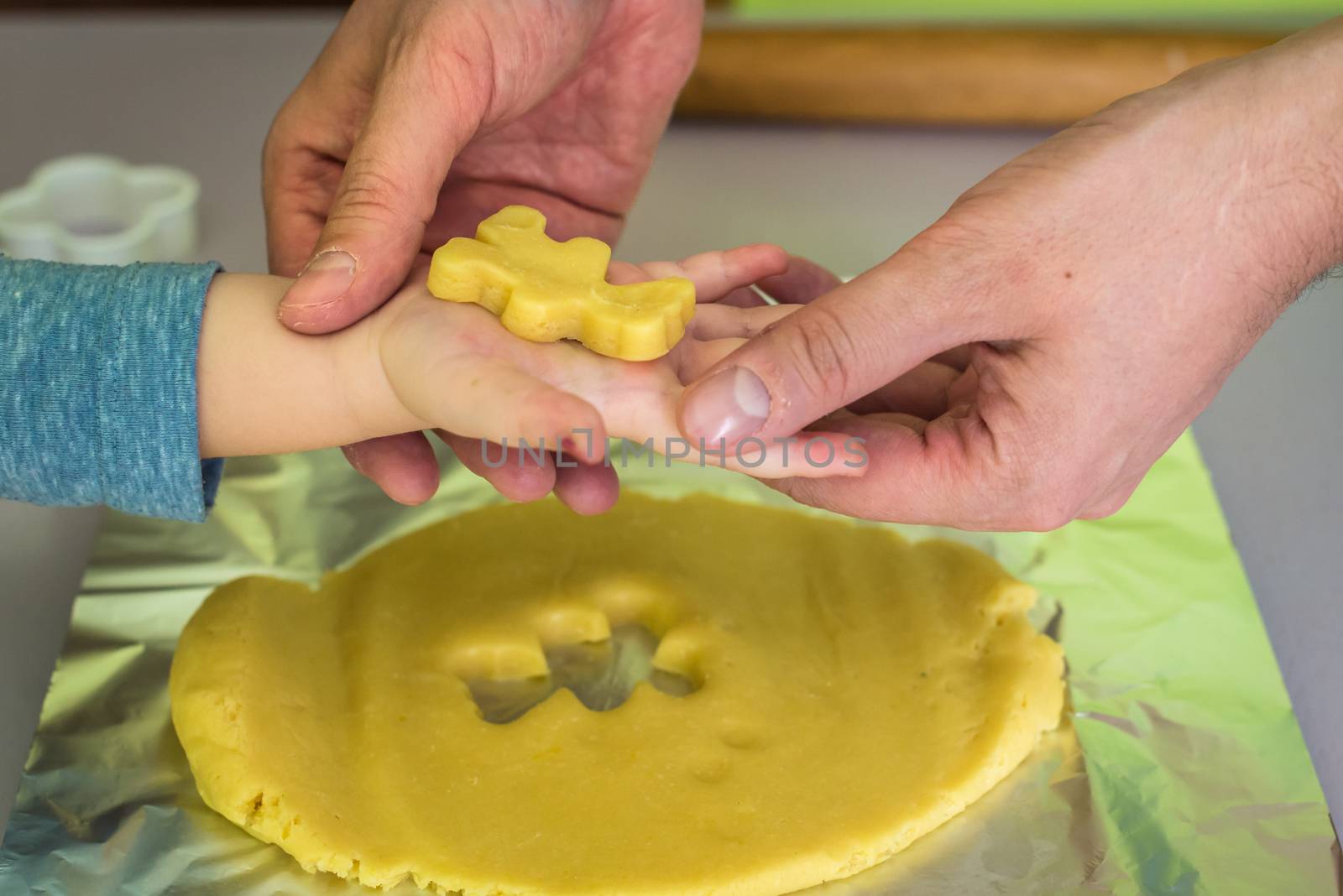 shortcrust dough for children's hands with dad hands