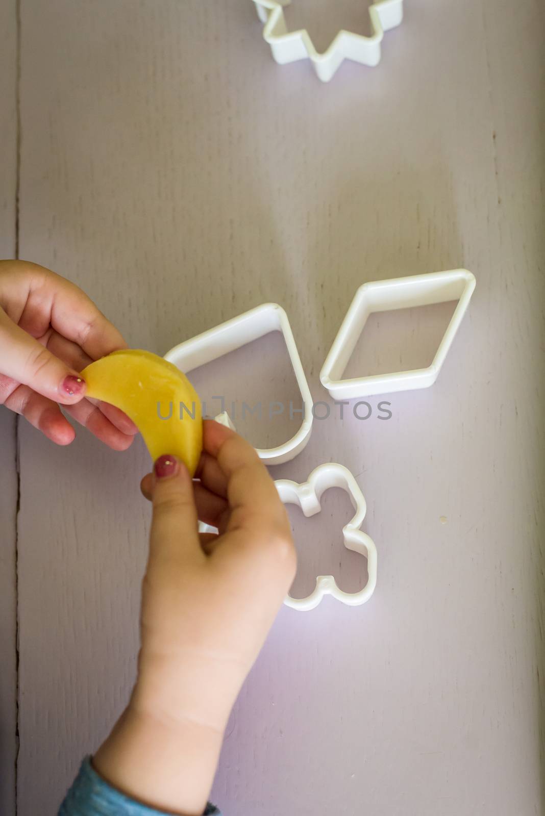 shortcrust dough in the shape of moon for children's hand