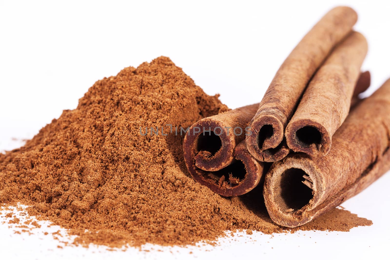 Cinnamon sticks and powder isolated on white background by mychadre77